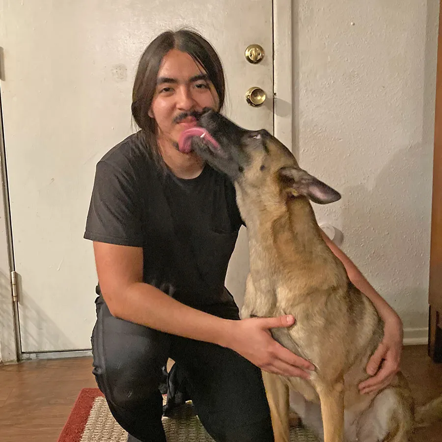 Carlos R. with his Malinois